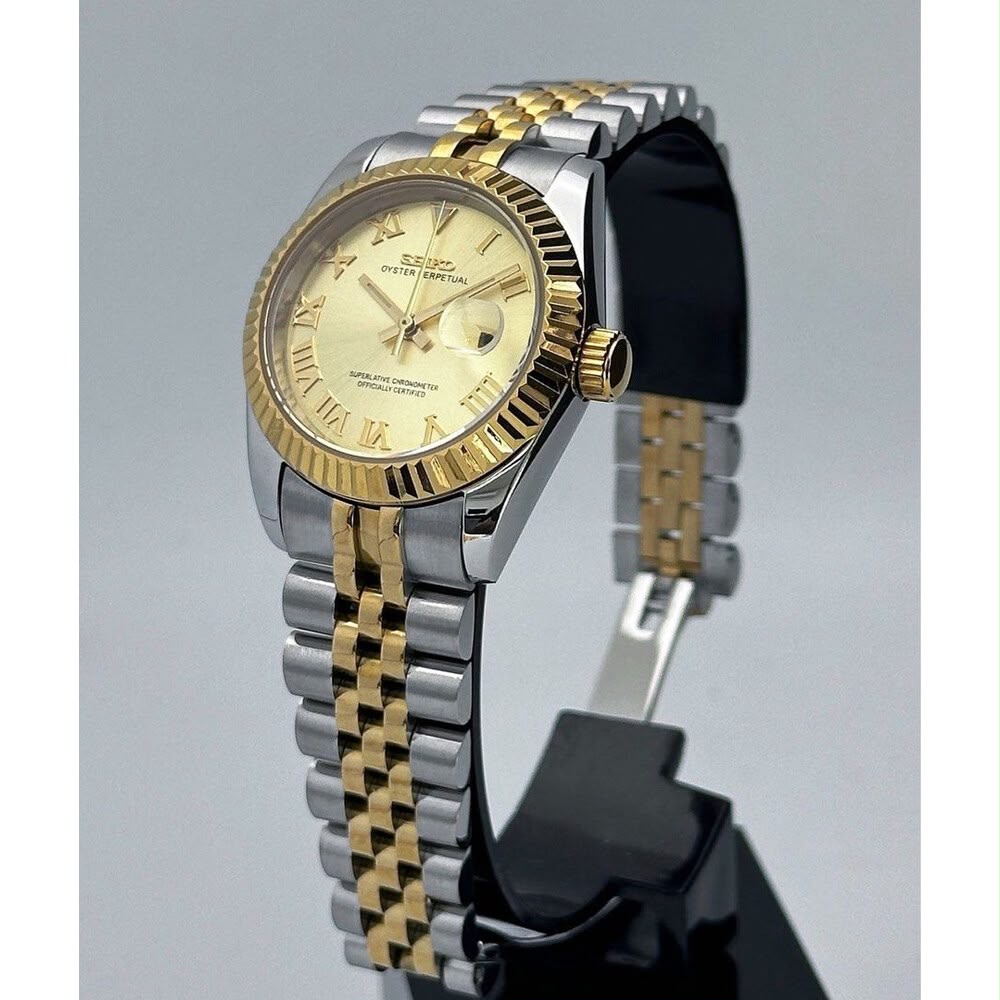 ORA Two-Tone Classic Date ladies Seiko Mod watch on display stand, gold champagne Roman numeral dial, yellow gold fluted bezel, 31mm/36mm – side view
