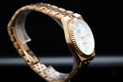 ORA Vanguard 36 rose gold white honeycomb dial close-up with date window and fluted bezel