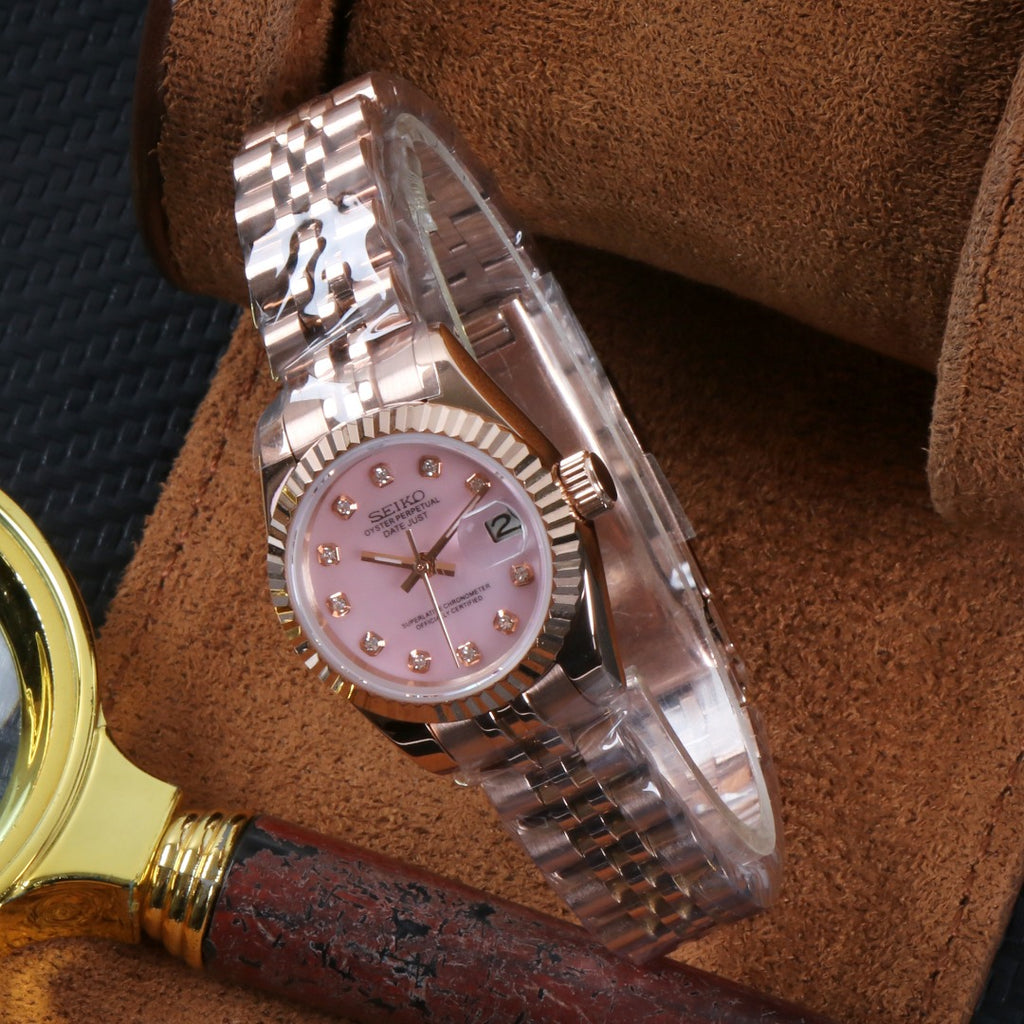 ORA Rose Gold Datejust ladies Seiko Mod watch, pink mother of pearl dial, diamond hour markers, 26mm – angled view